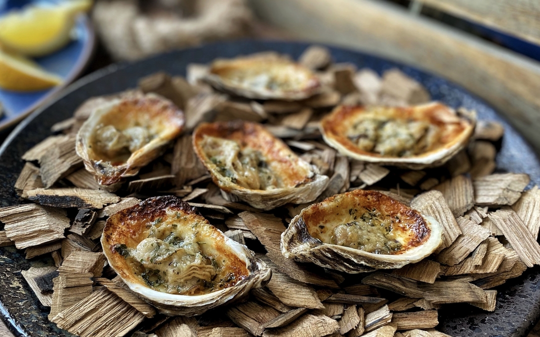 Grilled P.E.I. Oysters with Garlic Asiago Butter￼